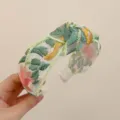 Serre-tête large avec broderie florale élégante et tissu en maille de style ethnique - Style Brodé Noué / Rose et Vert