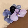 Elegant purple and blue orchid flower hair clip with pearl accents for women's hair styling - Phalaenopsis Hair Claw / Purple