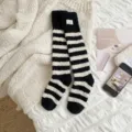 Comfortable black and white striped coral fleece mid-calf socks for warm sleeping. - One Size / Black and White