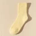 Close-up of a soft pale yellow coral fleece sock featuring a fluffy and cozy texture - Size 37-43 / Light Yellow