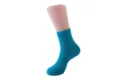 Vibrant cyan fuzzy coral fleece sleep socks for adults shown on a mannequin foot prop - Sizes 39-44 / Teal