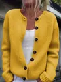 Close-up of women's loose mustard yellow knit cardigan with large dark buttons - 3XL / Tops / Lemon Yellow