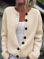Detailed view of a cream-colored loose-knit cardigan featuring large decorative buttons. - 3XL / Tops / Apricot