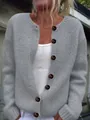 Close-up of a women's grey loose knit cardigan featuring large decorative brown buttons - 3XL / Tops / Gray