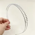 Close-up detail of a double-layer silver headband encrusted with sparkling clear rhinestones - 30-Rhinestone Style / Silver