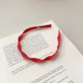 Elegant French style red braided fabric headband with a flat woven texture design - Flat Twist Braid / Red Spiral