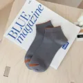 Stylische graue Herren-Füßlinge aus Baumwollmischung mit orangefarbenen Akzenten - Dunkelgrau