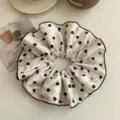 Elegant beige satin scrunchie with chic black polka dots and fine black edge stitching - Large Polka Dot / Off White