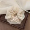 Elegant cream floral lace scrunchie hair tie featuring a delicate pearl bow detail - Fabric Ribbon Bow
