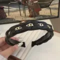 Elegant black braided leather headband with gold chain links for a high-top look. - Black