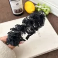 Elegant black ruffled lace headband with rhinestone details for a voluminous high top look - Black lace glitter diamond model