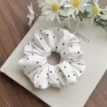 Elegant white padded cotton scrunchie with black heart patterns for women's hair styling - White Heart