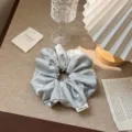 Elegant light blue satin oversized scrunchie hair tie with vintage silk texture - Blue