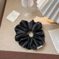 Elegant black satin scrunchie with high elasticity for vintage French hair styling - Black