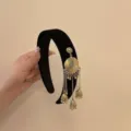 Serre-tête en velours noir avec glands de cloches dorées de style ethnique - Rond Doré d'un Côté / Noir