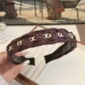 Dark brown braided leather headband featuring elegant interlocking gold chain links - Burgundy