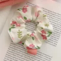 Elegant floral print scrunchie in creamy white with pink flowers for hair styling. - Little Floral