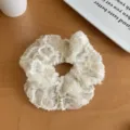 Elegant cream white four-layered lace scrunchie with subtle sequin details for hair styling - Relief Flower Scrunchie