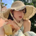 Elegant French straw hat for women with sun protection and delicate lace ribbon detail - Lace Trim Straw Hat / Beige