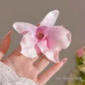 Realistic pink orchid flower hair clip, approximately 4cm in size, held by hand. - 1# Orchid Hair Clip - Pink / Approx. 4cm