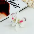 Elegant white orchid flower hair clip featuring realistic petals and soft pink details. - 11# Cymbidium Hair Clip - White
