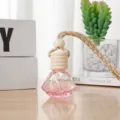 Car hanging perfume glass bottle with wooden cap and pink liquid, stylish rearview mirror pendant. - 8ml / Pink