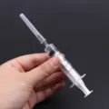 Perfume dispenser syringe tool with needle and 5ml capacity scale for easy refilling. - 5ml Syringe (Includes Needle)
