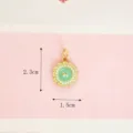 Detailed view of a gold butterfly charm with pearls and dimensions 2.3cm x 1.5cm. - Green Butterfly