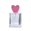 Flacone di profumo vuoto in vetro trasparente con dettaglio tappo cuore rosa perfetto. - 50ml / Bottiglia trasparente con tappo rosa