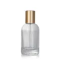 Clear glass refillable perfume bottle 50ml with gold spray pump for travel and cosmetic use. - Gold