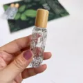 Bouteille à billes en verre pour huiles essentielles avec bouchon en bambou et corps texturé. - Flacon de 10 ml en forme de margose / Transparent