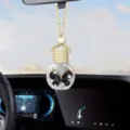 Flacone di profumo sospeso per auto con tappo di legno e decorazione a farfalla nera. - Nero