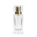 Empty 50ml square glass perfume bottle with gold spray nozzle and clear crystal cap for travel. - Gold