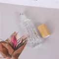 Flacon Roll-on en Verre 10ml pour Huile Essentielle avec Bouchon en Bambou Naturel - 10ml / Relief Melon Amère (Bille en Acier)