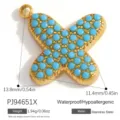 Ciondolo a farfalla lettera X in acciaio dorato con pietre blu per gioielli fai da te - Alfabeto X (PJ94651X)
