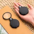 Portable folding pocket magnifier with black leather case, 50mm diameter, 5x optical zoom. - 50mm Portable Foldable