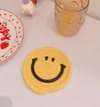 Cute yellow braided cotton rope cup coaster with black smiley face detail for table decor - 12cm / Yellow