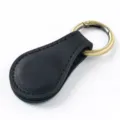 Black leather magnetic clip, portable hat clip and bookmark holder with bronze metal ring variant. - Crazy Horse Black
