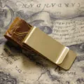 Brass money clip and pen holder with carved leather loop, vintage traveler notebook accessory. - Brass - Carved Yellow-Brown