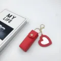 Red leather lipstick case keychain with heart mirror pendant, portable mini holder for daily use. - Red Heart Mirrors