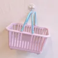 Detailed view of the cute pink plastic storage basket with blue handles for desktop organization. - Square / Pink