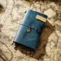 Vintage blue leather traveler notebook with brass clip and cute heart charm. Perfect journal. - Portable Size / Blue