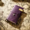 Vintage purple leather traveler notebook TN diary with metal clip and retro feather charm. - Portable Size / Purple