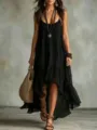Detailed view of the black bohemian resort slip dress, featuring a chic U-neck and hem. - S / Dresses / Black