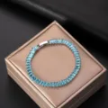 Elegant silver bracelet with blue baguette-cut AAA cubic zirconia stones on jewelry box - Aquamarine