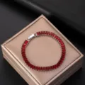 Close-up of AAA red zircon bracelet with elegant rectangular stones on jewelry box - Red