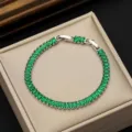 Close-up detail of silver-toned tennis bracelet featuring radiant AAA green zircon stones - Platinum Plated Green