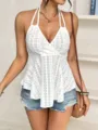 Detail shot of a white halter eyelet embroidery camisole top paired with denim shorts for summer. - XS / Tops / White