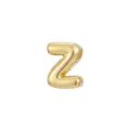 Macro view of a shiny gold bubble letter Z charm accessory for DIY jewelry pieces. - Letter Z