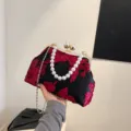 Elegant black evening bag featuring red 3D floral embroidery and stylish pearl handle - Black with Red